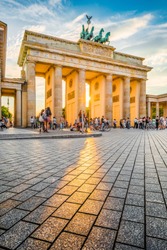 Famous Brandenburger Tor, one of the best-known landmarks and national symbols of Germany, in beautiful golden evening light at sunset, Berlin, Germany