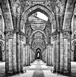 Historic ruins of abandoned abbey in black and white
