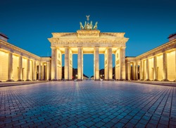 Classic view of famous Brandenburger Tor (Brandenburg Gate), one of the best-known landmarks and national symbols of Germany, in twilight during blue hour at dawn, Berlin, Germany