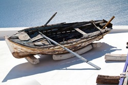 The view of old boat on the roof Santorini village Firostefani
