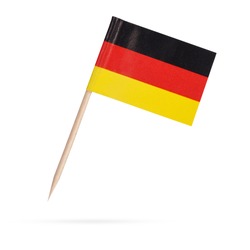 Miniature paper flag Germany. Isolated German flag on white background. With shadow below