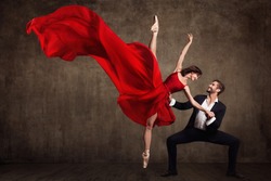 Ballet Couple Dance, Beautiful Woman in Red Dress and Man in Suit, Ballerina in Fluttering Flying Fabric 