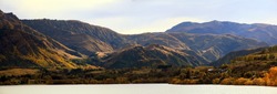 Panorama of Mountain alpine alps range at Lake Hayes Queenstown NewZealand