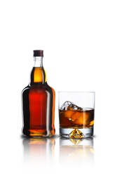 Whiskey Bottle and Glass With Ice Cubes