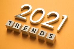 Wooden blocks with the word Trends and metal numbers 2021. Popular , relevant topics. New trends of fashion.