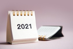 Happy new year 2021. Close up calendar on a pink desktop