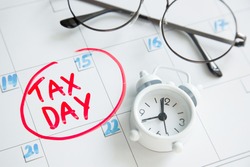 concept for Tax day or april 15 , 2021 the national deadline for filing taxes. inscription on the calendar board