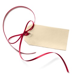 Blank gift tag with a red ribbon bow, isolated on white.