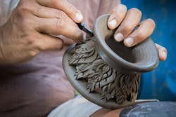 close up potter artist working on clay pottery sculpture fine art in thailand 