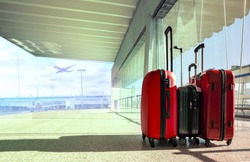 stack of traveling luggage in airport terminal and passenger plane flying for air transport and traveling theme