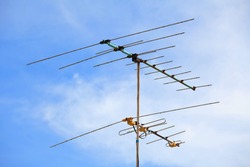 Television antenna with blue sky