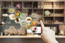 Customer use AR application to order food in restaurant, Hand touching virtual interface for order menu in restaurant, Augmented reality with electronic menu for restaurant. 