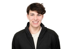 Portrait of a happy teenager boy 15-17 years old with dark hair and a dark sports jacket on a white background, the guy is smiling, charismatic appearance, isolated