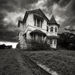 A derelict old house on top of a hill