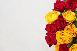 Red and yellow roses bouquet. Mothers day, Valentines Day, Birthday celebration concept. Copy space for text, top view