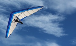 Hang Glider Hang Glider flying in the sky on a bright blue day