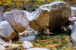 Large boulders balance above a stream in South Korea
