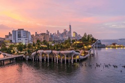 Cityscape of downtown Manhattan skyline with the Little Island Public Park in New York City at sunrise