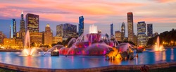 Chicago skyline panorama with skyscrapers and Buckingham fountain at twilight.