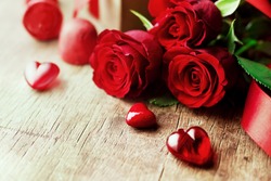 Roses and a hearts on wooden board, Valentines Day background, wedding day