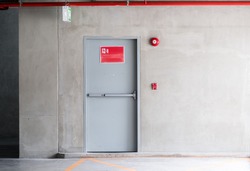 Fire exit door for emergency case of the parking building near the business office.