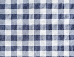 Closeup of the navy checked fabric for decoration in the restaurant, front view for the background.