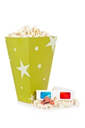 Popcorn bucket with two tickets and 3D anaglyph glasses isolated on a white background