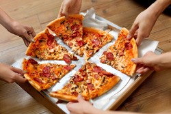 Eating Food. Close-up Of People Hands Taking Slices Of Pepperoni Pizza. Group Of Friends Sharing Pizza Together. Fast Food, Friendship, Leisure, Lifestyle.