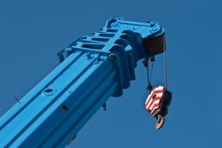 raised boom 250 ton truck crane against the sky