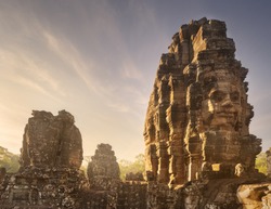 Day view of ancient temple Bayon Angkor complex with stone faces of buddha Siem Reap, Cambodia
