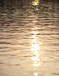 sunset reflecting on the surface of lake water