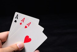 Hand with three aces