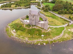 An aerial view of Dunguaire Castle, a 16th-century tower house situated on the south-eastern shore of Galway Bay, thought to be the most photographed castle in Ireland.