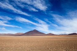 Desert and mountain over blue sky and white clouds on Altiplano,Bolivia