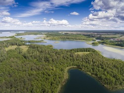 Lake Wigry National Park. Suwalszczyzna, Poland. Blue water and whites clouds. Summer time. View from above.