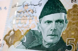 Muhammad Ali Jinnah, founder of Pakistan, printed on a used Pakistan banknote for 500 Rupees.  Image taken at an angle, less than 80% of note showing.