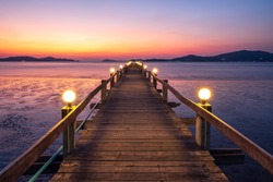 Wooden bridge of Chan Damri Beach at sunset ,Ranong ,Thailand