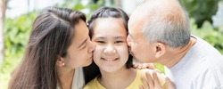 Header crop of Lovely Asian three generation family with grandfather and mother kissing teen girl, concept of family togetherness