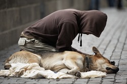 Beggar with dog on the street of Prague, Czech Republic
