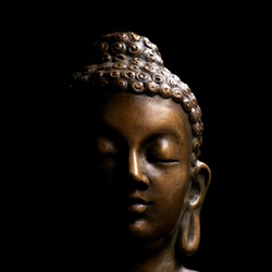 Buddha portrait isolated on black