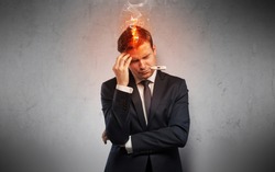 Fever businessman with burning head concept