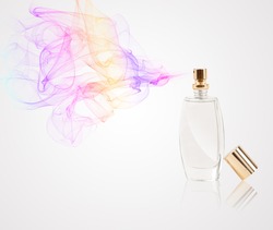 Perfume bottle spraying colorful scent