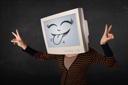 Young girl wearing a monitor with a funny face gesture