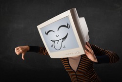 Young girl wearing a monitor with a funny face gesture