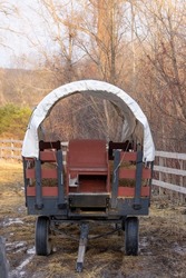 Close up view of old covered wagon in the farm