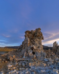 Tall Tufa sedimentary formation by mono lake in California under evening sun light.