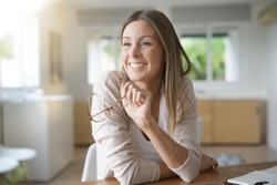 Cheerful woman working from home