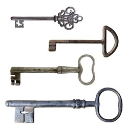 Four old rusty door keys isolated on white.