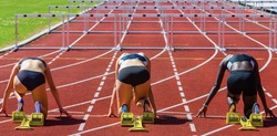hurdle runners in start position