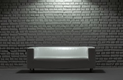 white modern leather sofa and brick background